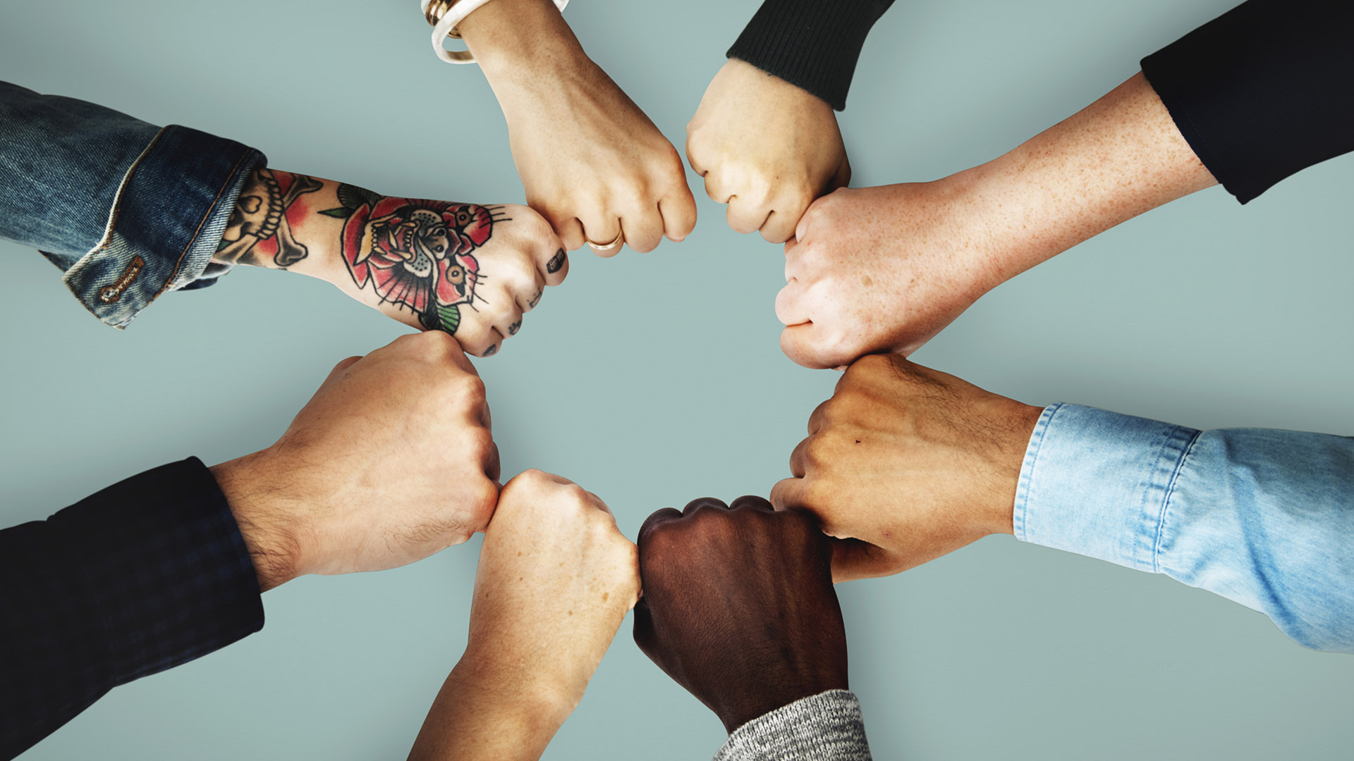 Fists come together